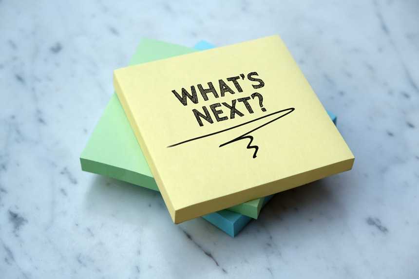 pile of sticky notes that say "what's next"