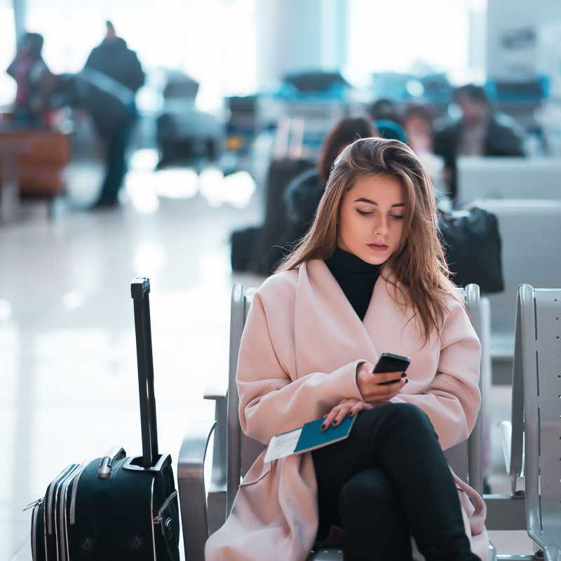 Woman on phone in the airport