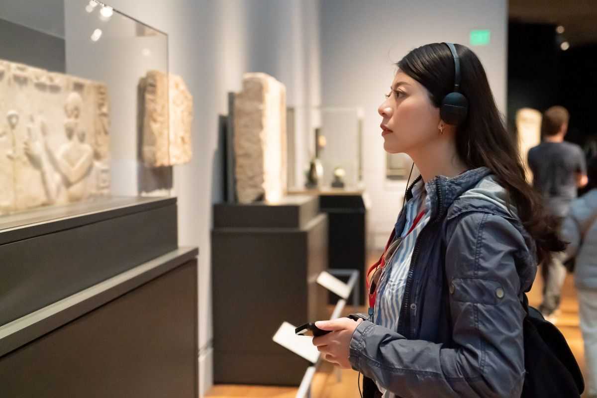 Woman looking at art