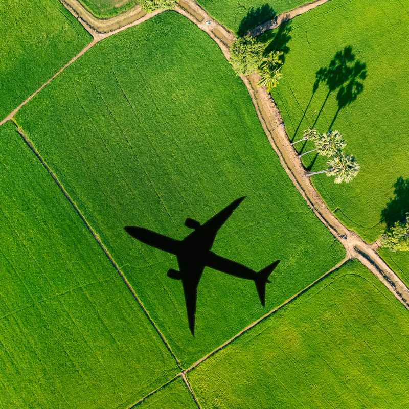 Airplane flying over a field