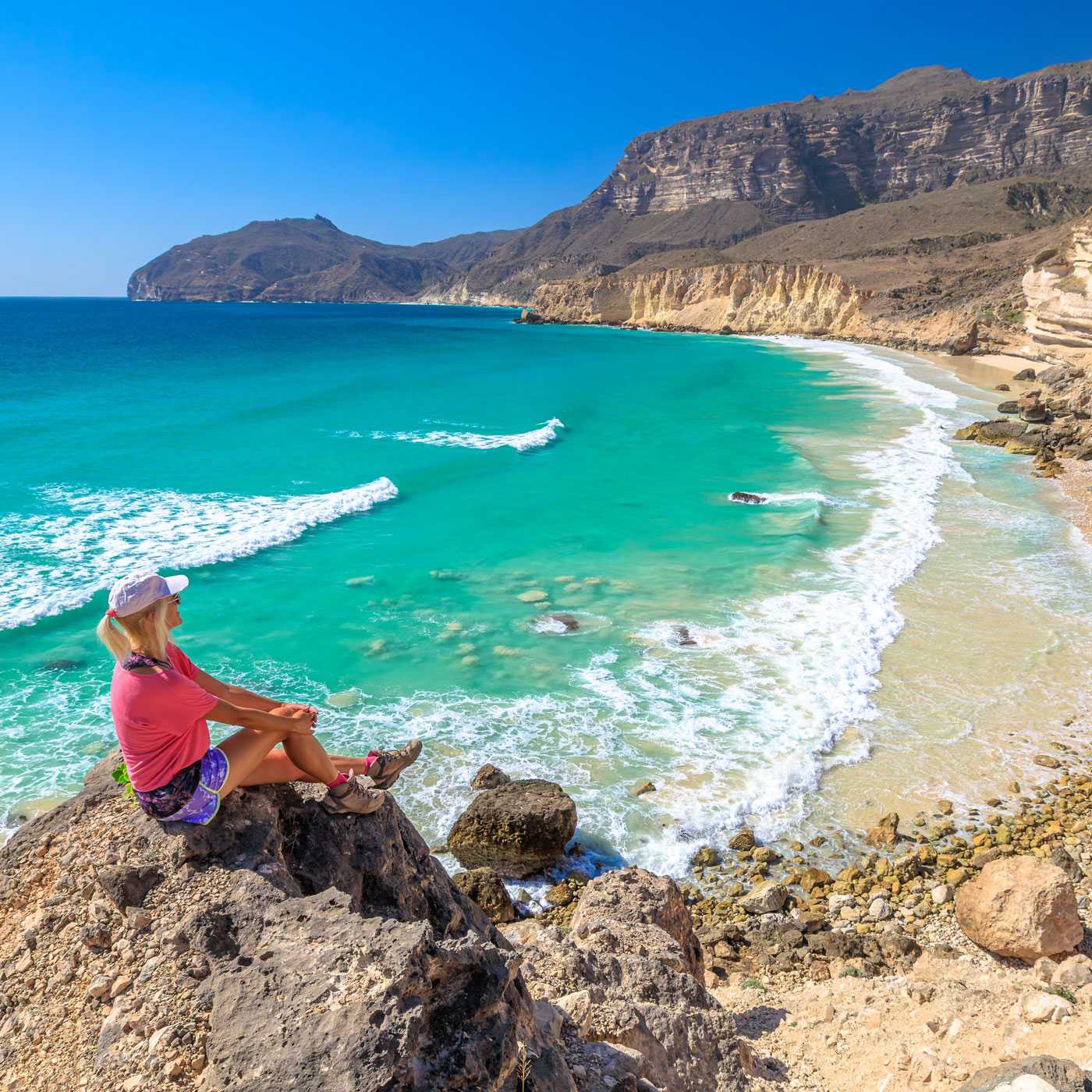 hiker on beach in Oman