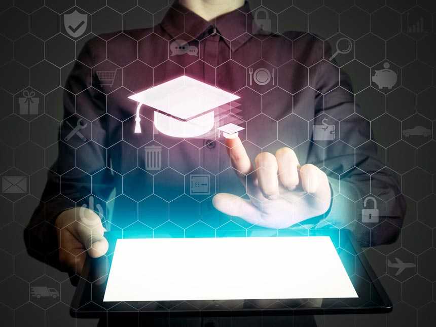 man holding a tablet with graduation cap icon