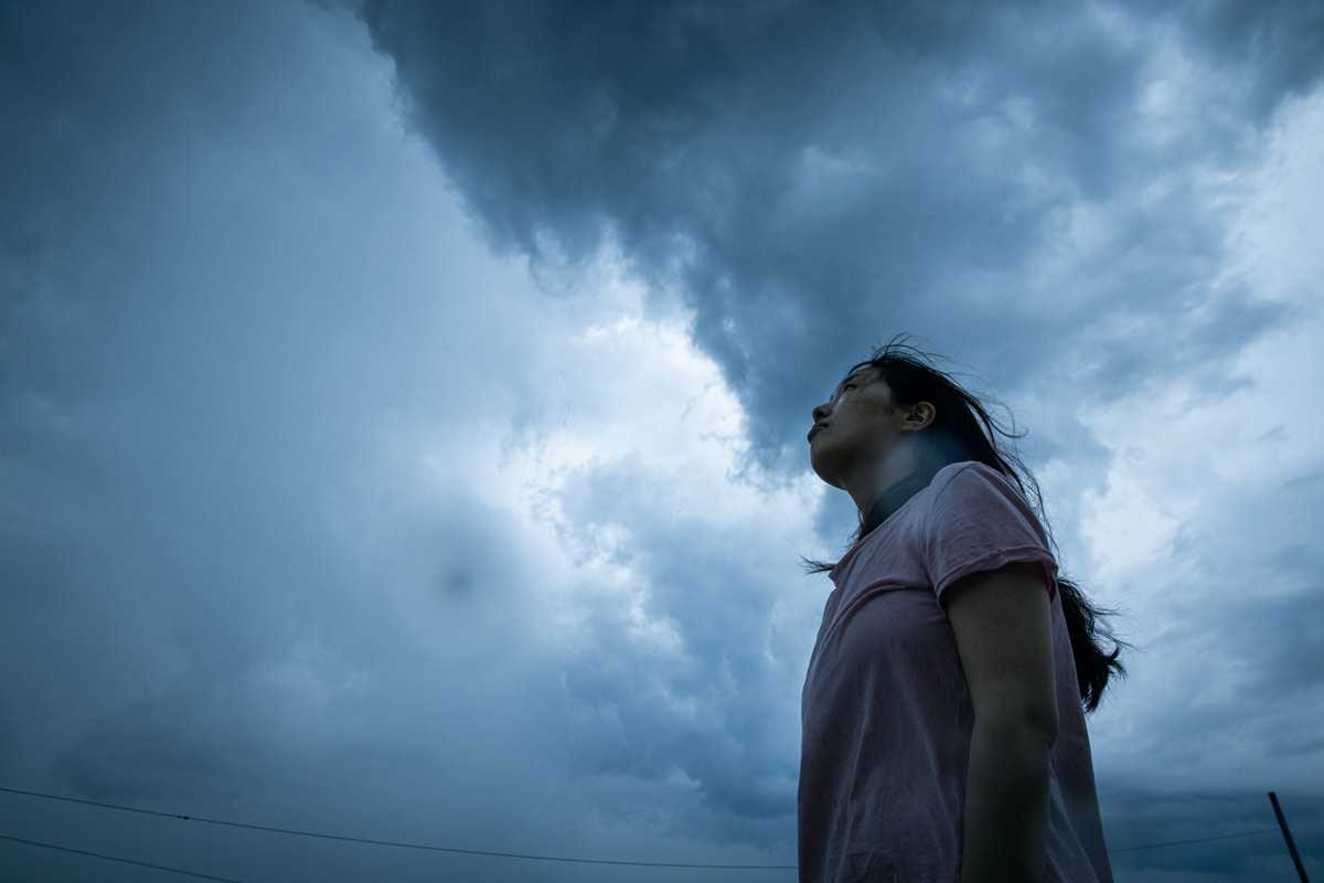 woman watching storm