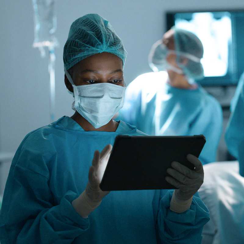 Doctor using a tablet in the operating room