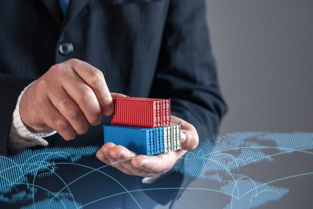 Hand holding shipping containers