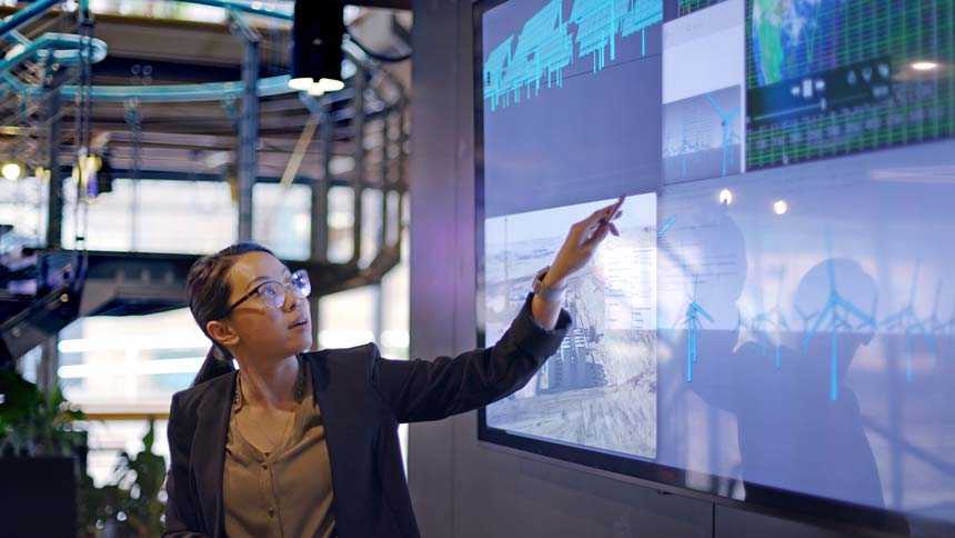 Woman pointing at energy monitor
